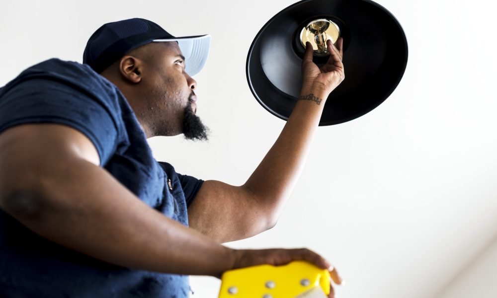 man-changing-light-bulb-lamp-2023-11-27-04-58-49-utc